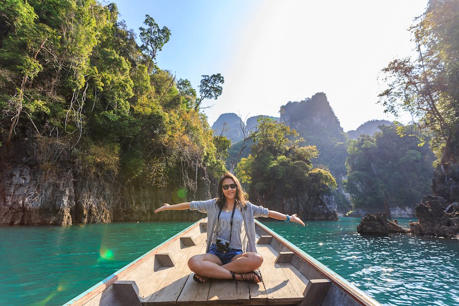 Asian woman relishing a serene boat journey through Thailand's Khlong Sok