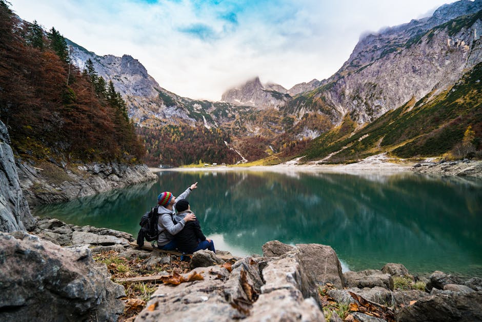 A couple enjoys a scenic view of Hallstatt Lake